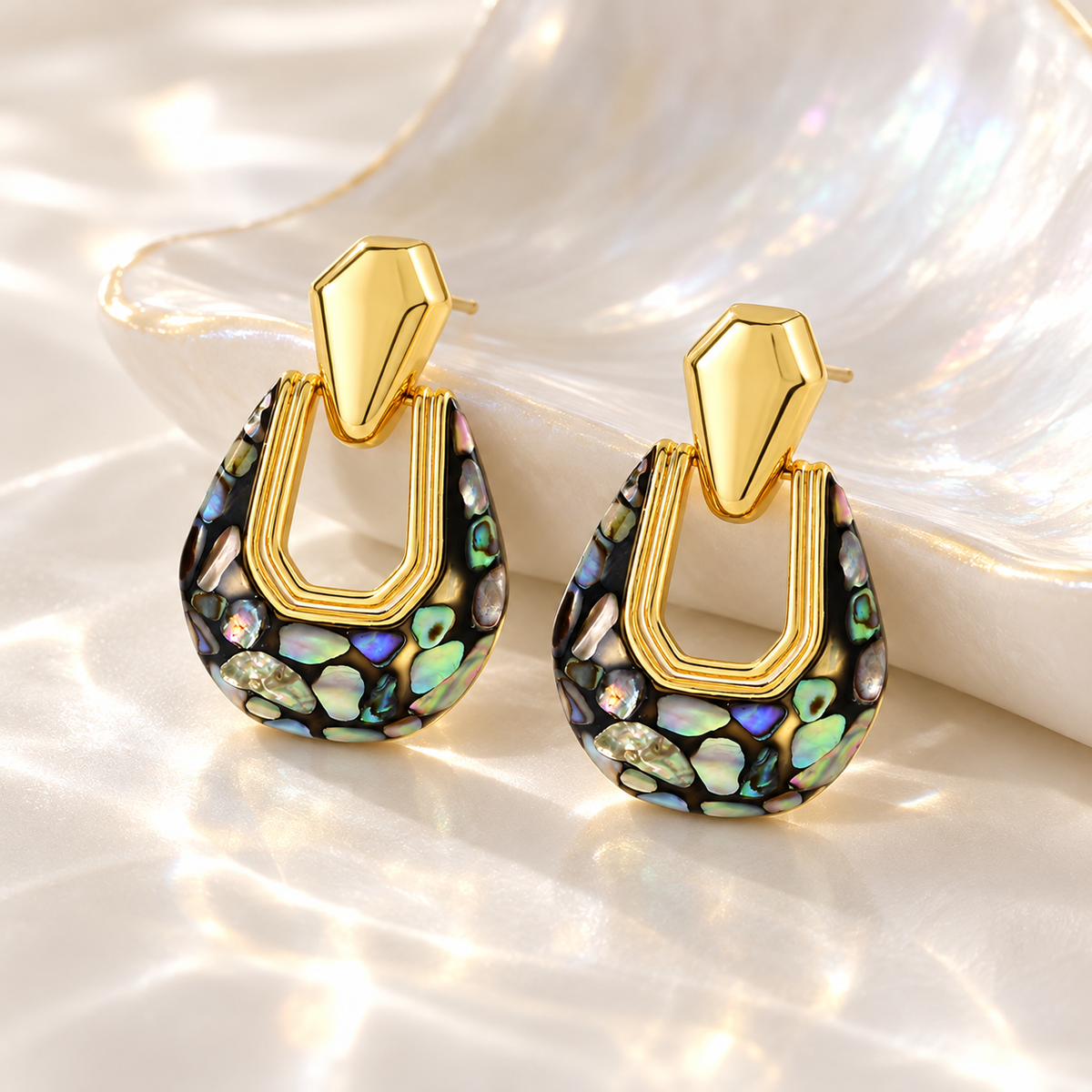Gold-tone geometric earrings with iridescent abalone shell