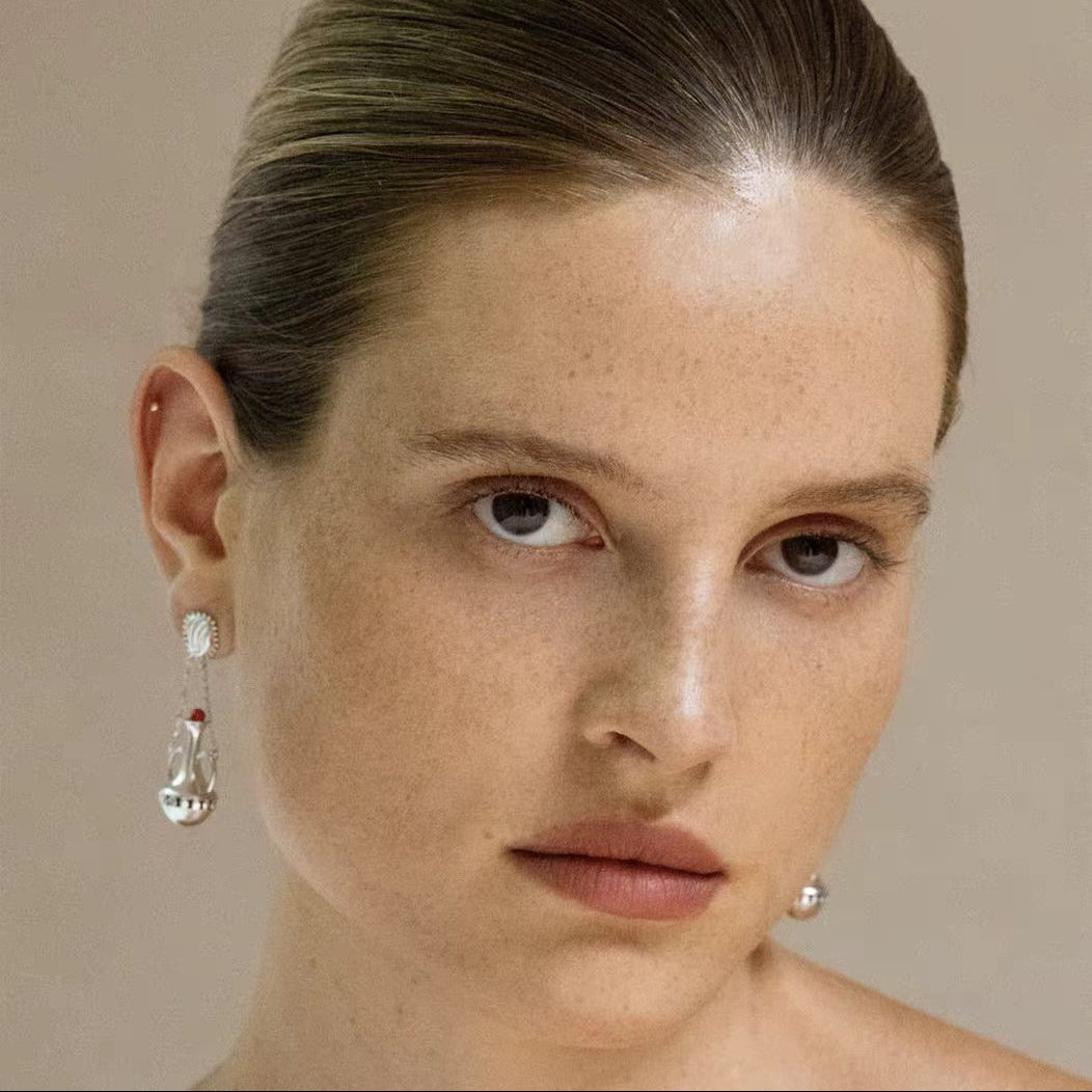 Silver-tone amphora red agate drop earrings styled on model