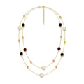 Layered gold-tone long necklace with black burgundy pale accents and crystal beads