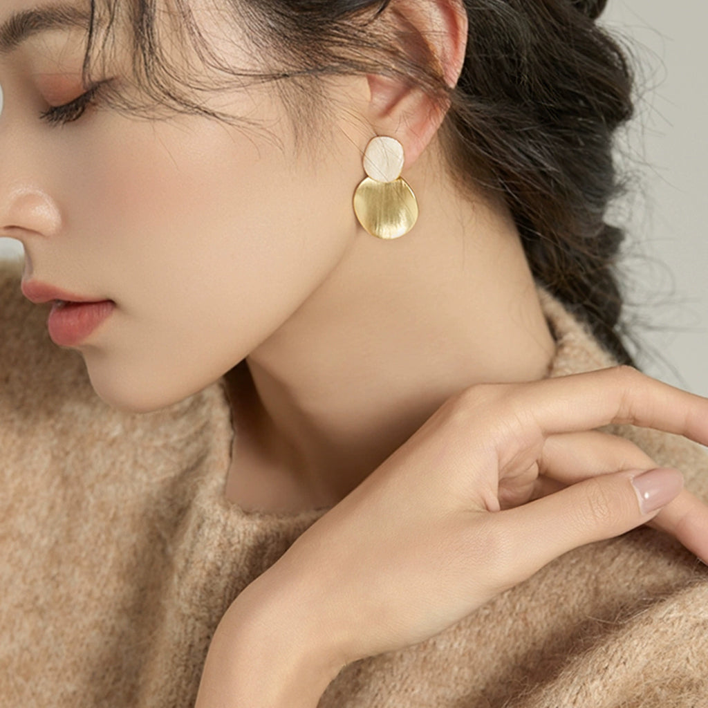 Model wearing Brushed Double Disc Stud Earrings in Gold-Tone