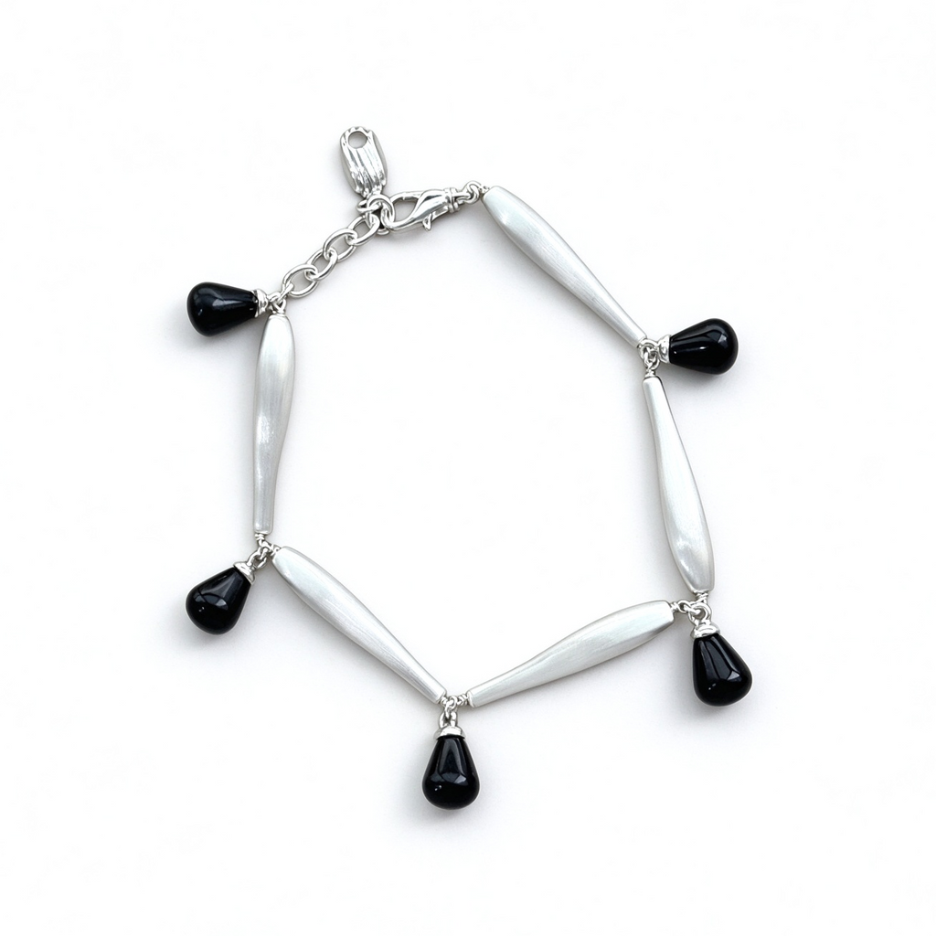 Brushed Silver Black Onyx bracelet with sculptural metal links and teardrop stones