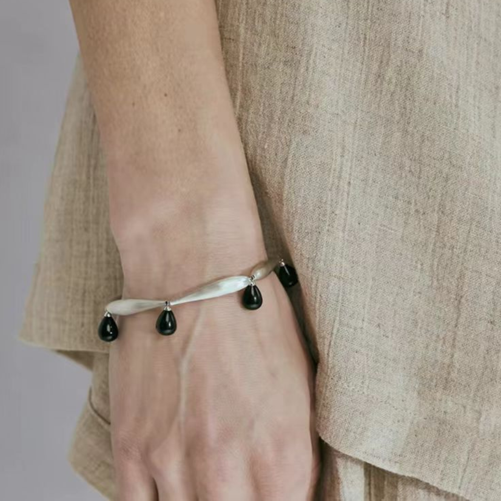 Model wearing Brushed Silver Black Onyx bracelet on wrist