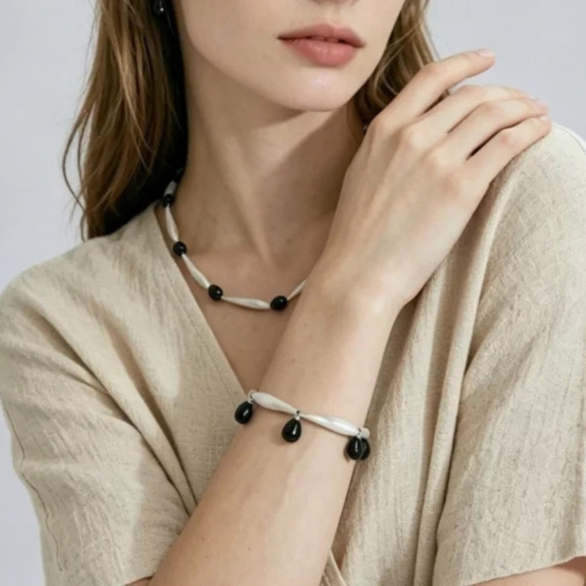 Close-up of Black Onyx necklace and bracelet styled together
