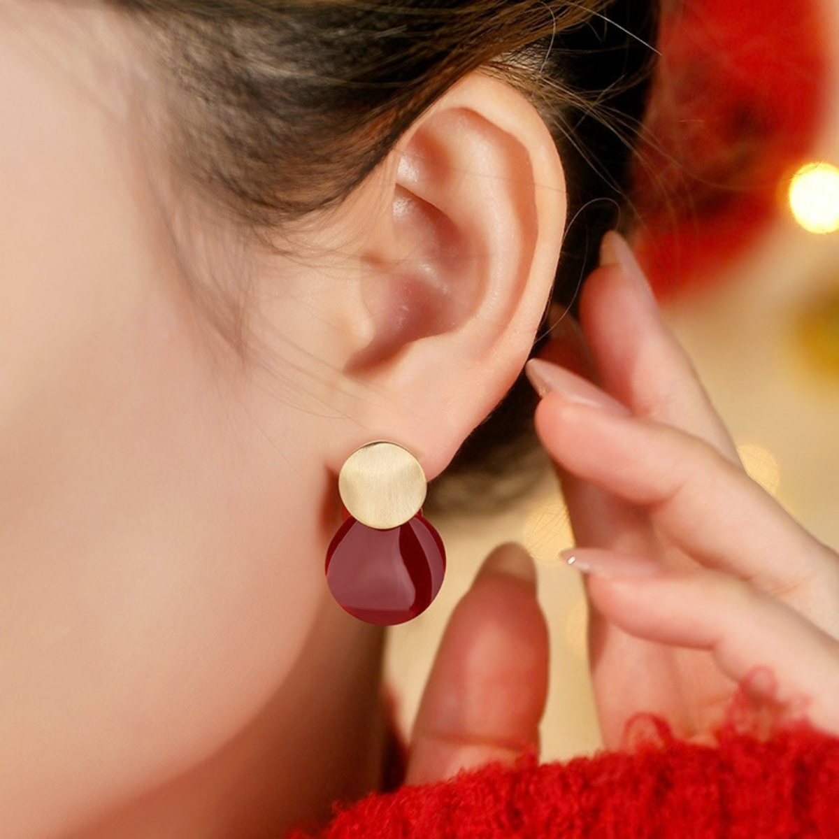Model wearing Burgundy Sculptural Stud Earrings by Troveform