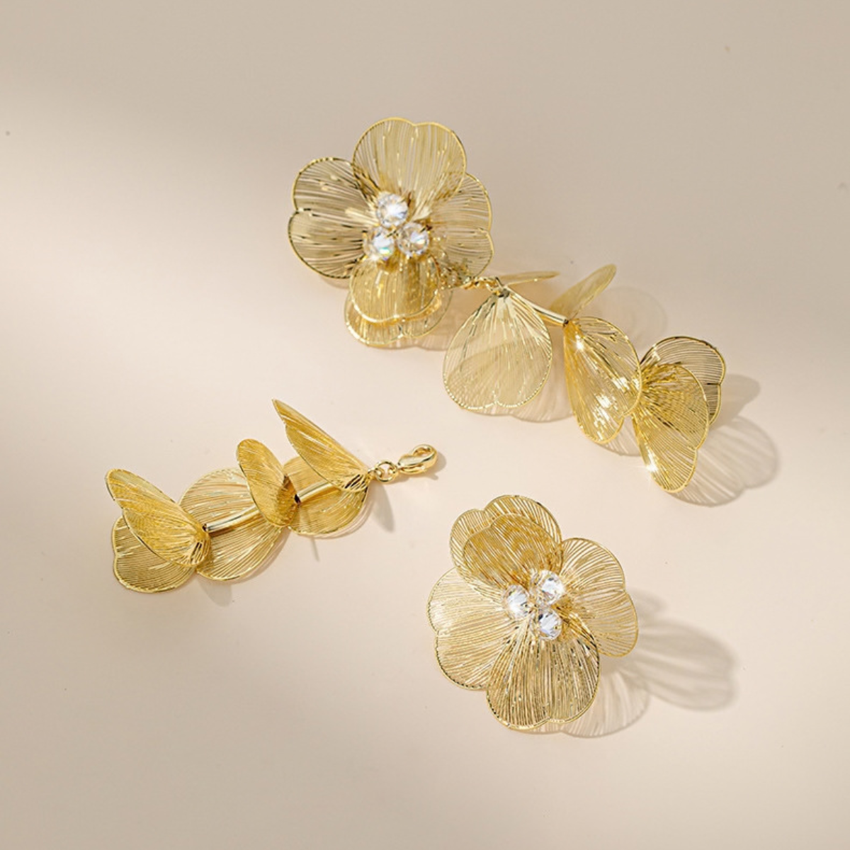Detachable Gold-Tone floral earrings showing removable petal drops