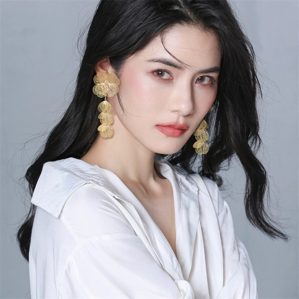 Gold-Tone Detachable Floral Drop Earrings worn with cascading petal drops