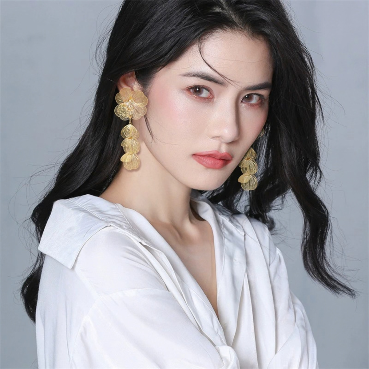 Gold-Tone Detachable Floral Drop Earrings worn with cascading petal drops