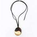 Ebony wood pendant necklace with brushed gold-tone metal and black leather cord