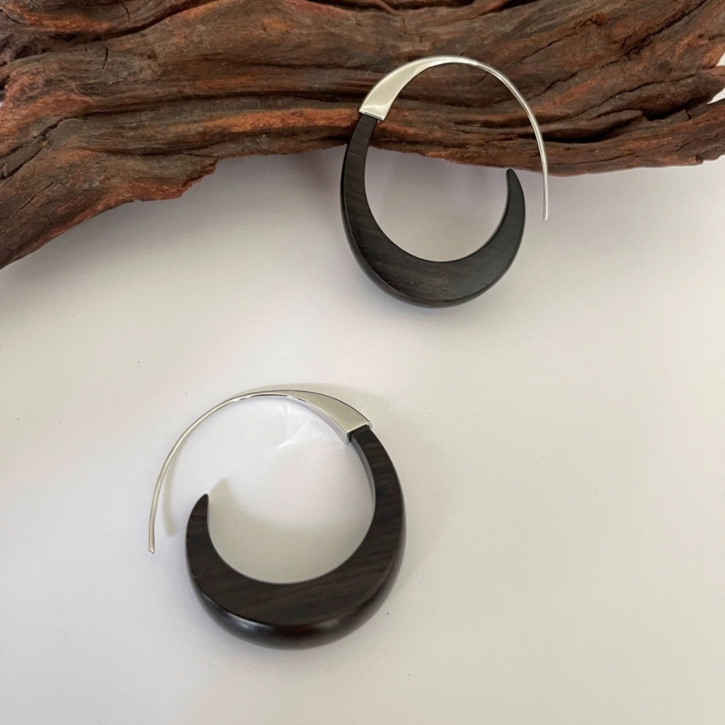 Ebony Wood Hoop Earrings showing natural wood grain and curved metal detail