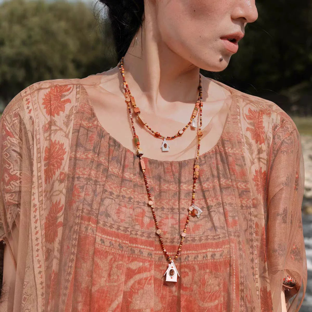 House Charm mixed-stone short and long necklaces styled together