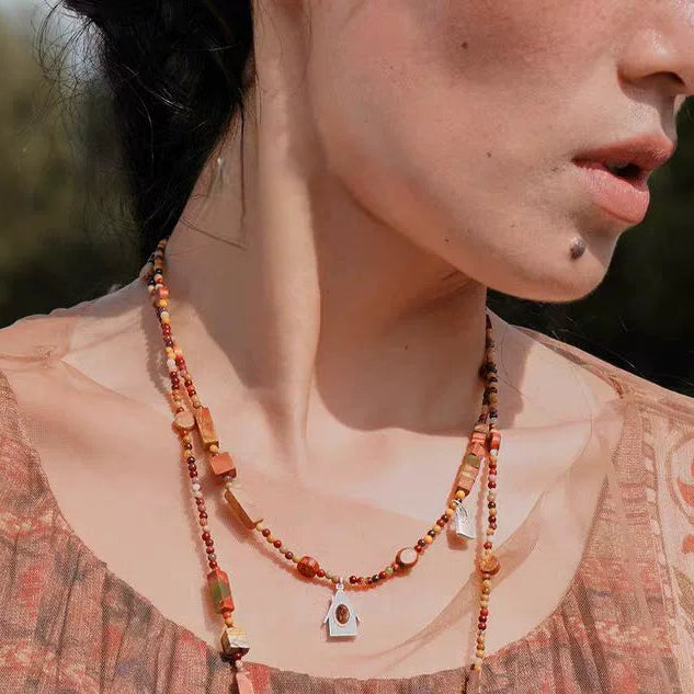 House Charm mixed-stone short necklace worn at the collarbone