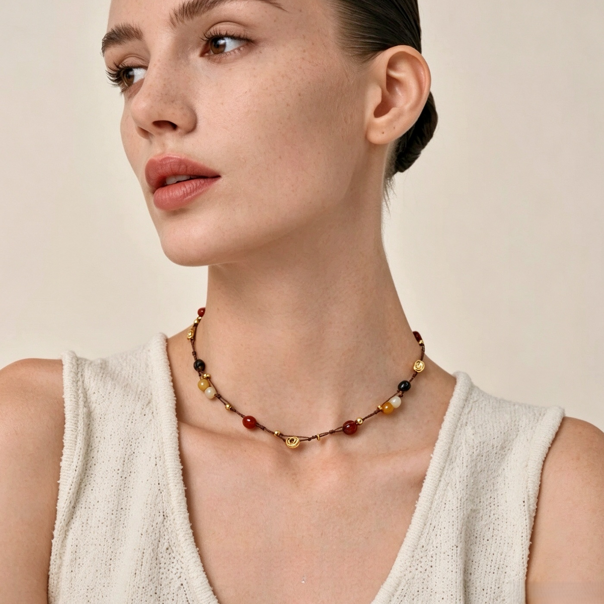 Multicolor natural stone necklace worn as a short choker