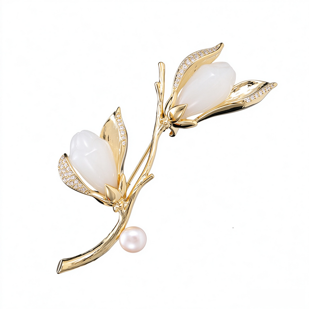 Gold-tone magnolia pearl branch brooch with zircon accents