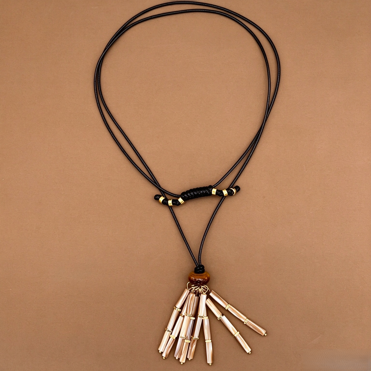 Long mother-of-pearl tassel necklace with black cord