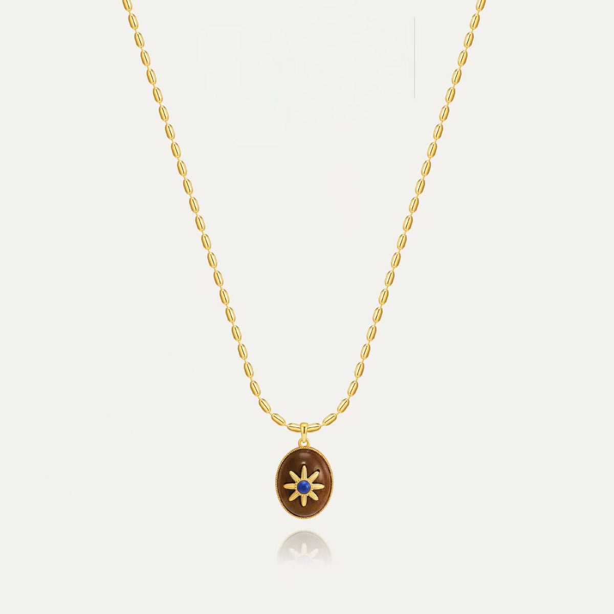 Motu Blue wood and lapis pendant necklace with Gold-Tone chain details