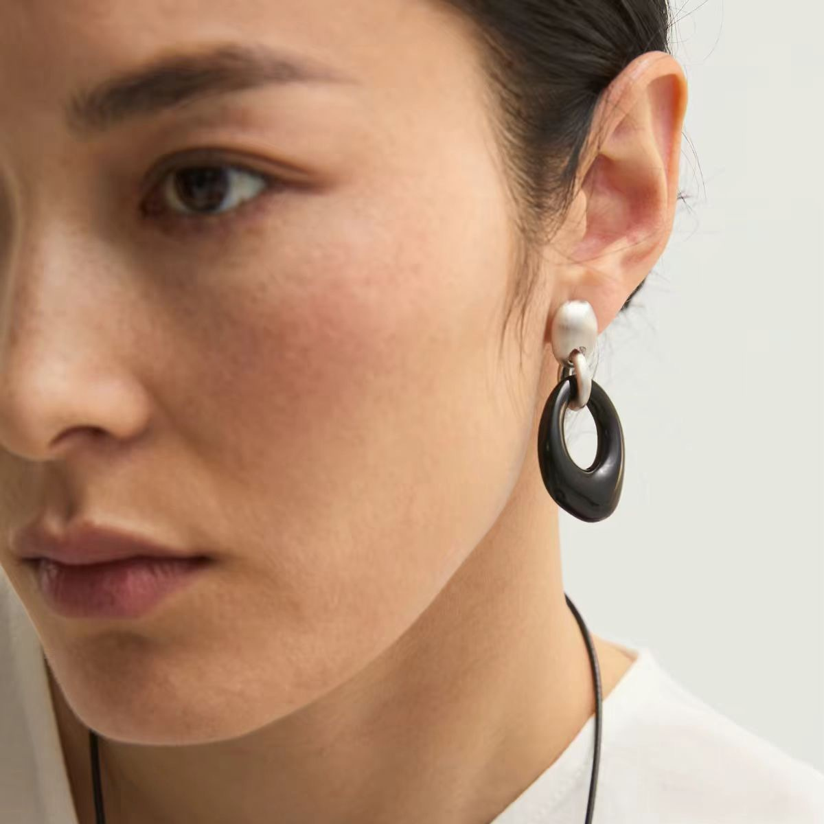 Black onyx drop earrings with brushed silver-tone tops