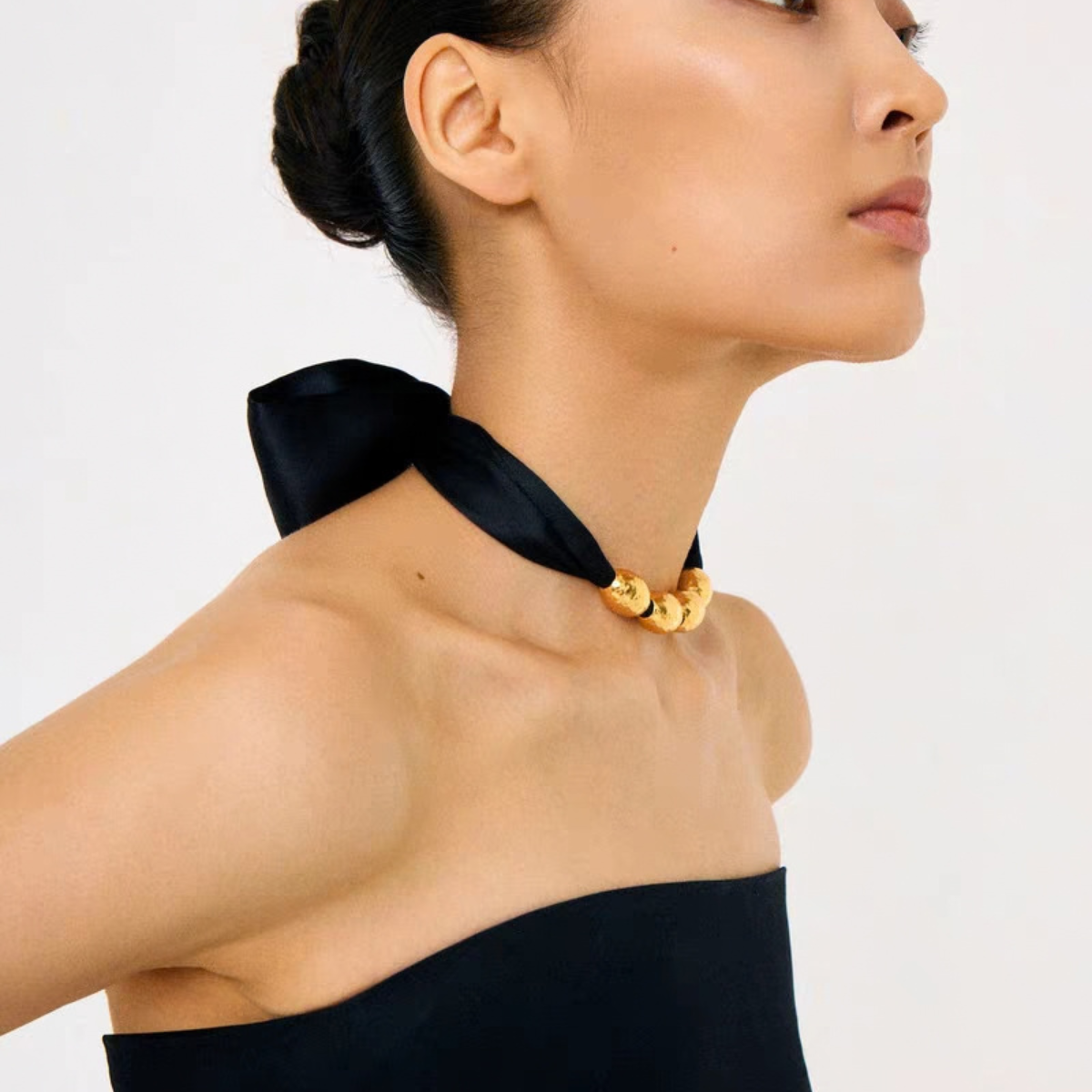 Gold-tone bead choker necklace with wide black ribbon tie