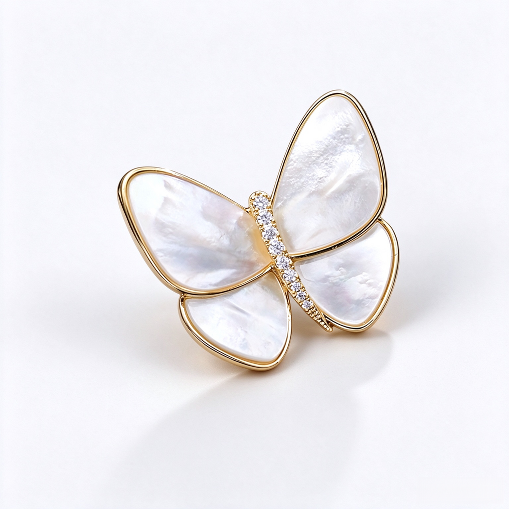Gold-tone shell butterfly brooch with zircon details