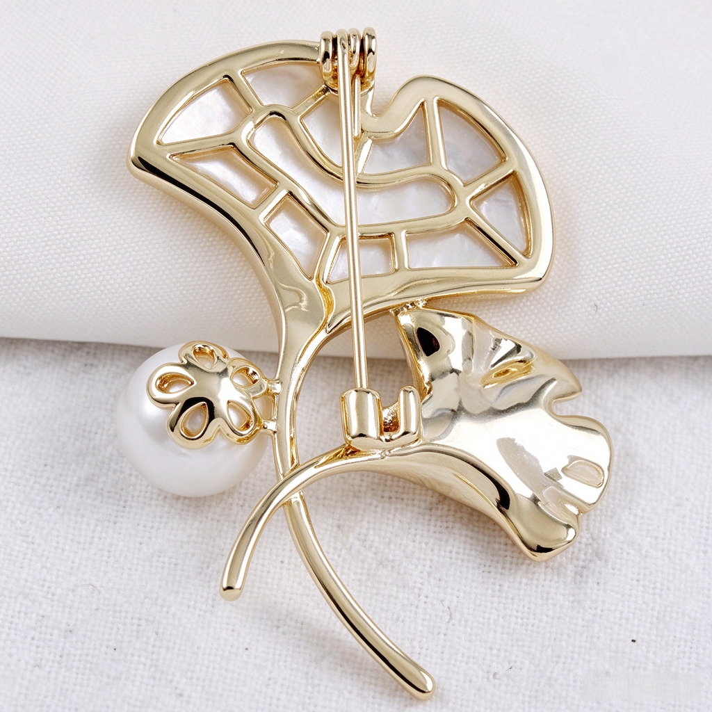 Back view of shell ginkgo brooch with pin fastening