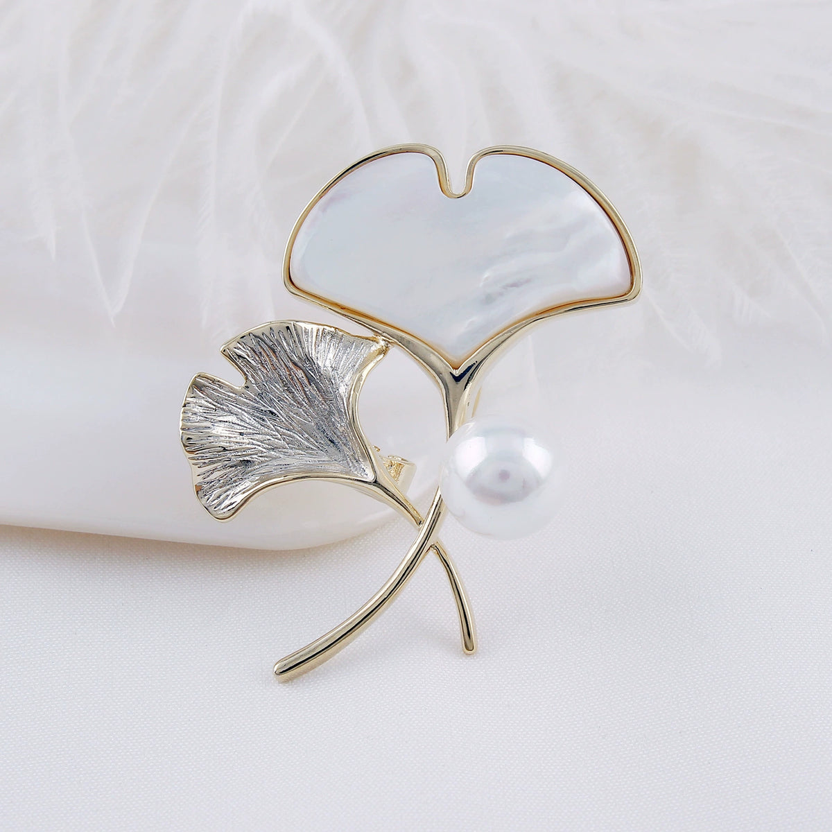 Gold-tone shell ginkgo brooch with sculptural botanical leaves