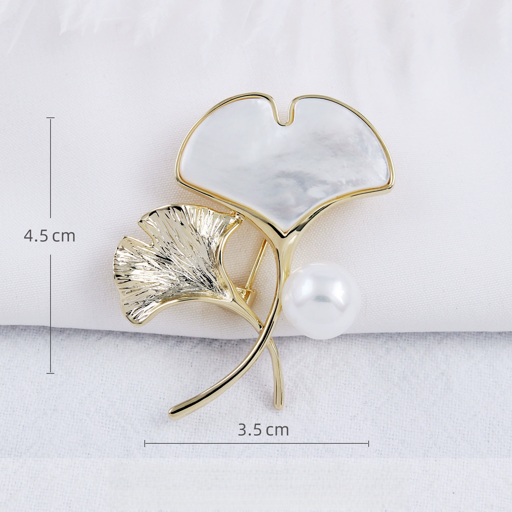 Shell ginkgo brooch measuring approximately 4.5 by 3.5 cm