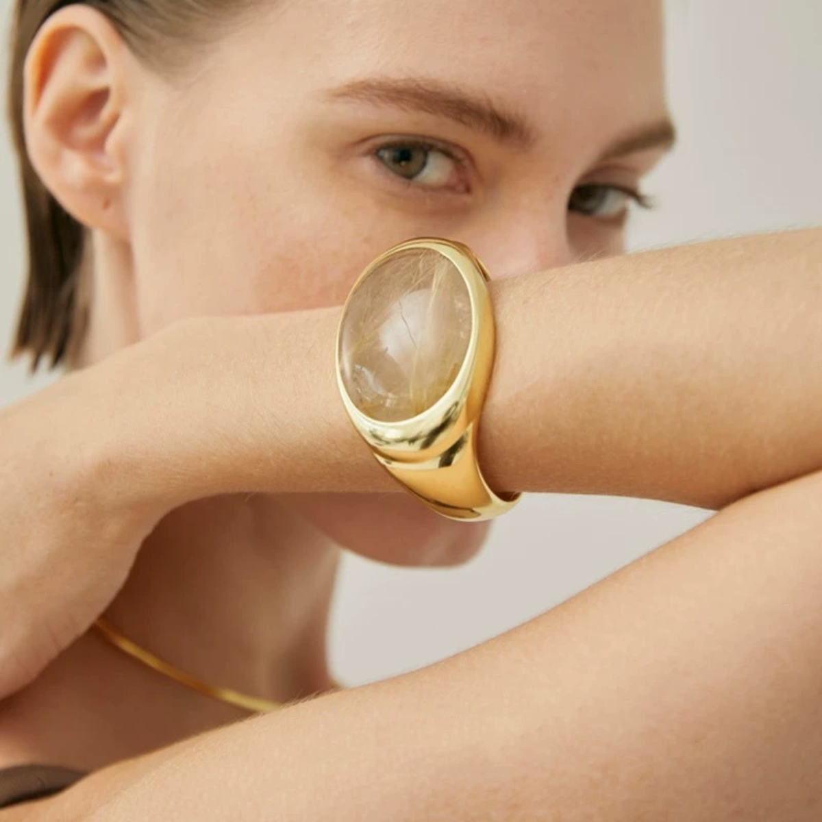Natural smoky quartz cuff bracelet worn on the wrist