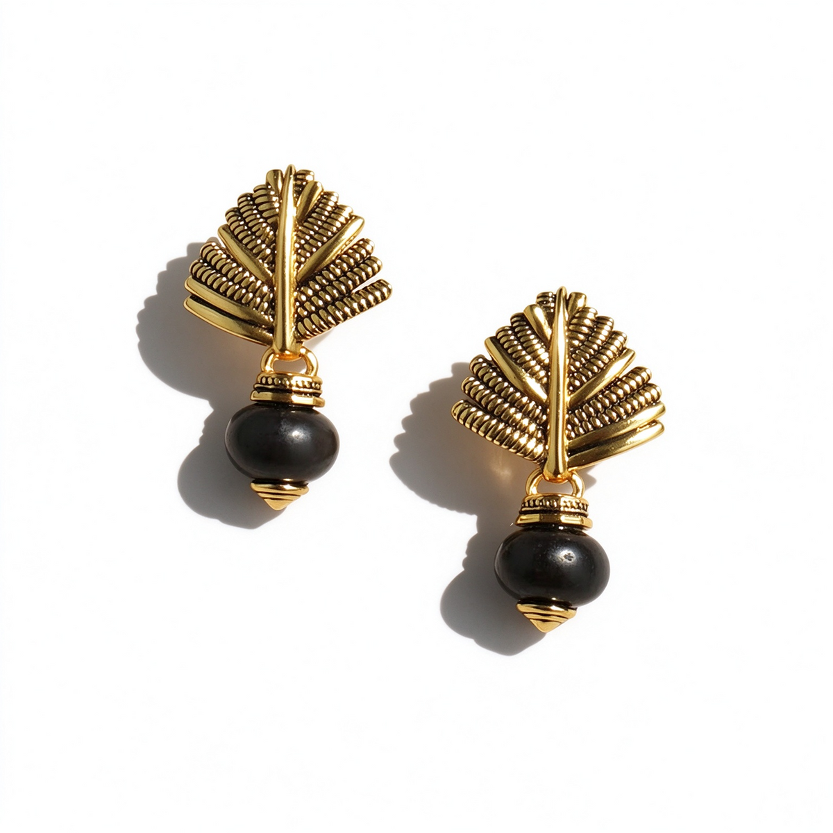 Gold-tone Swaying Palm stud earrings with textured brass leaf designs and caramel agate bead drops