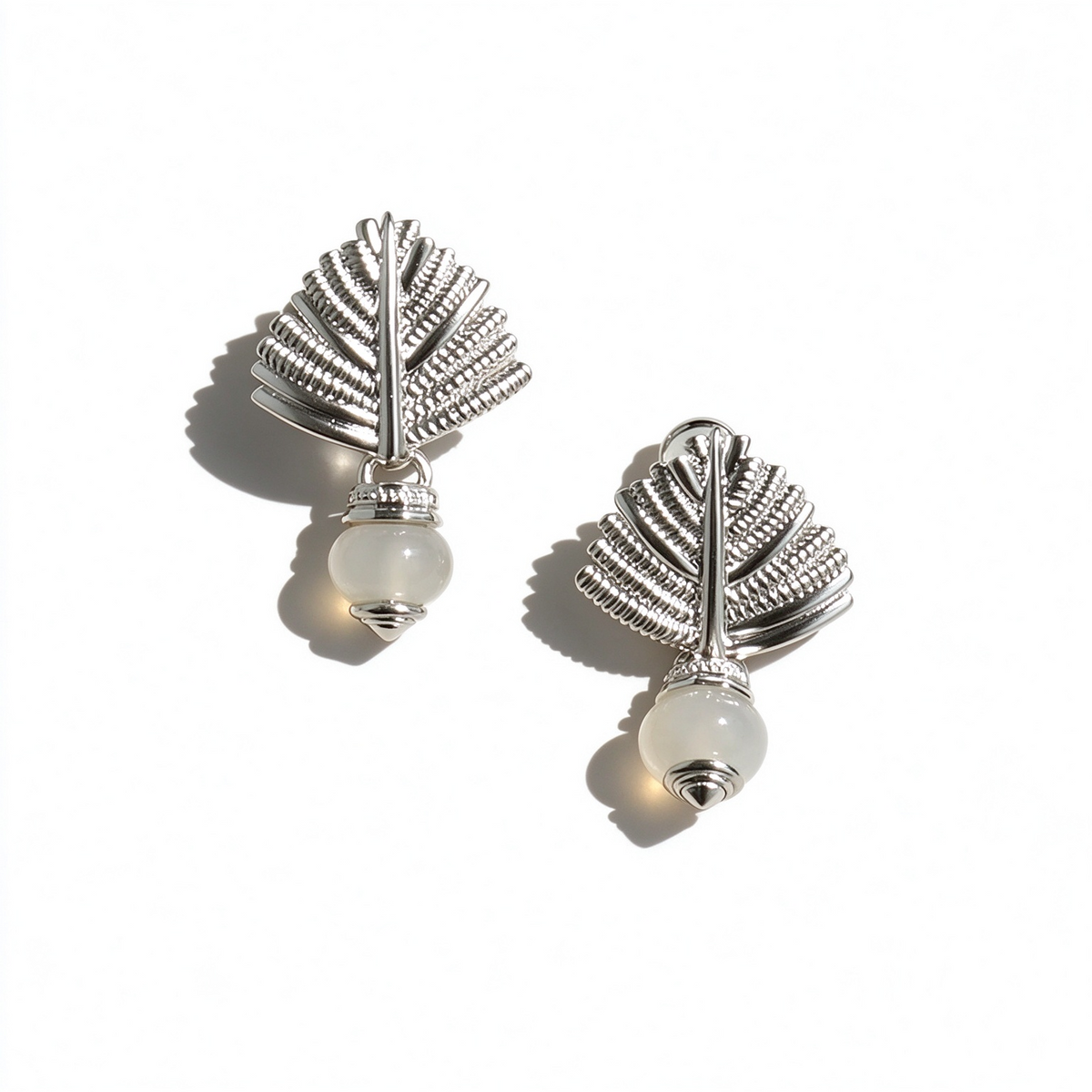 Silver-tone Swaying Palm stud earrings with textured palm leaf forms and gray agate drops