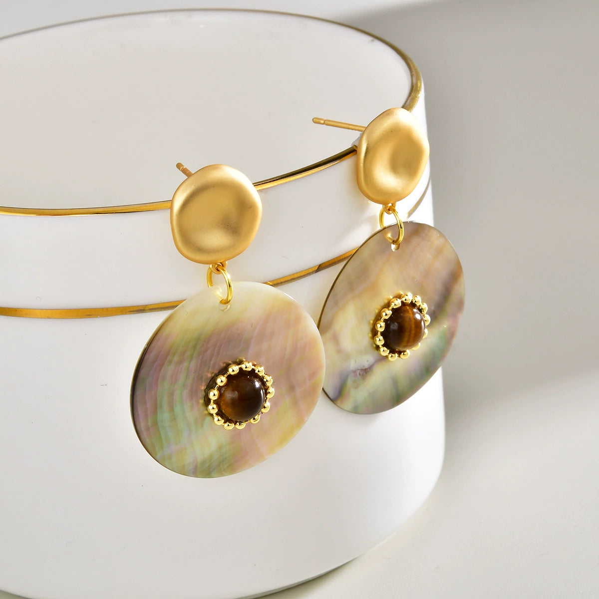 Gold-Tone drop earrings with Tiger Eye centers and Abalone Shell discs