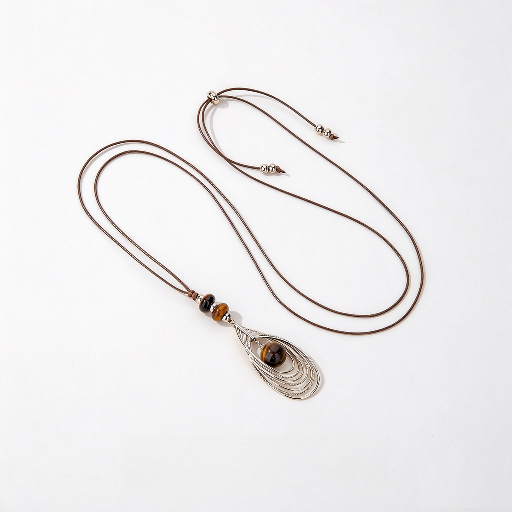 Long brown cord necklace with tiger eye sculptural pendant