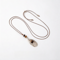 Long brown cord necklace with tiger eye sculptural pendant