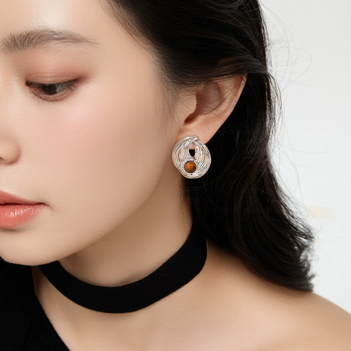 Model wearing Tiger Eye Sculptural Stud Earrings by Troveform