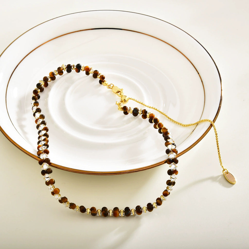 Tiger eye vintage collar necklace styled with warm gold-tone details