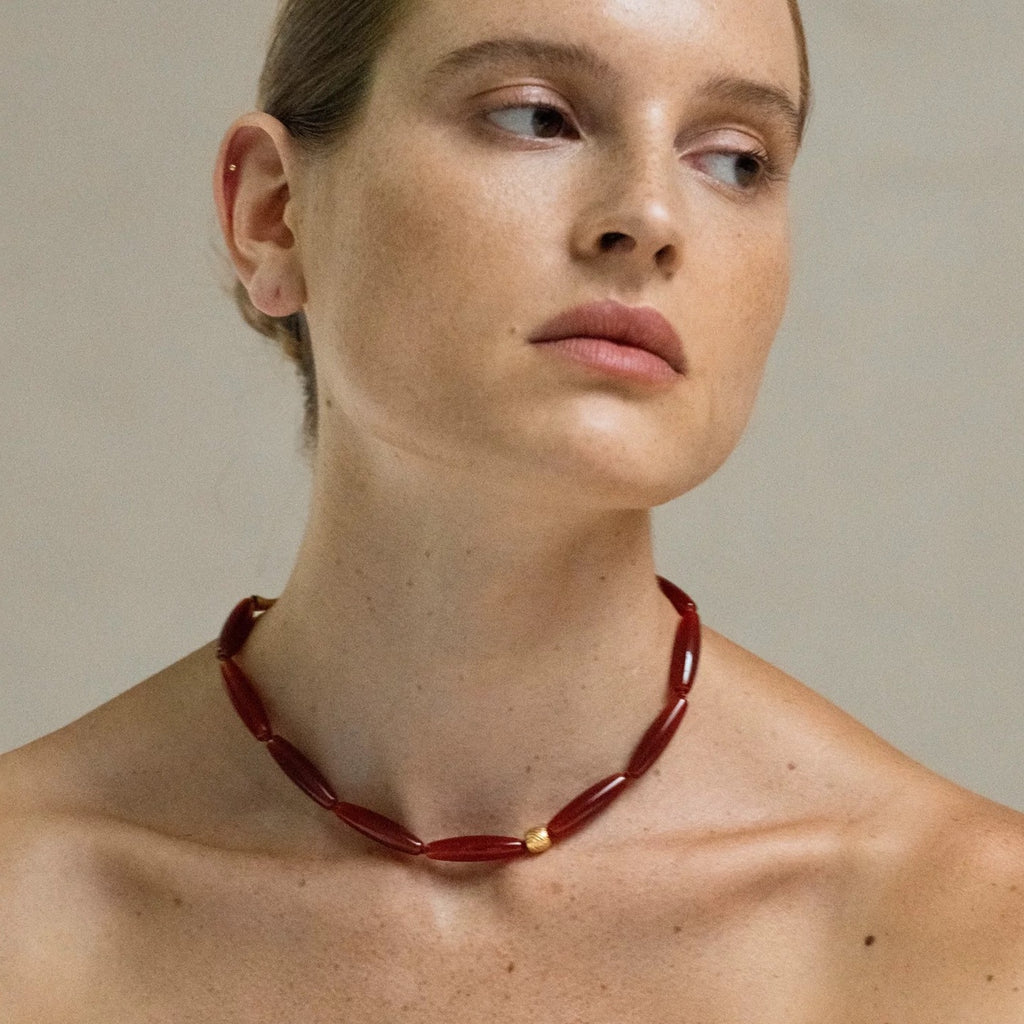Model wearing the Vessel Red Agate collar necklace