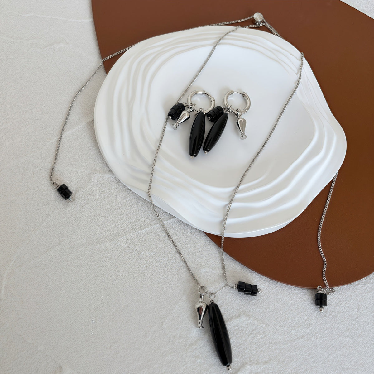 Vessel Black Onyx long necklace and sculptural earrings styled together