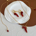 Vessel Red Agate long necklace and sculptural earrings styled together