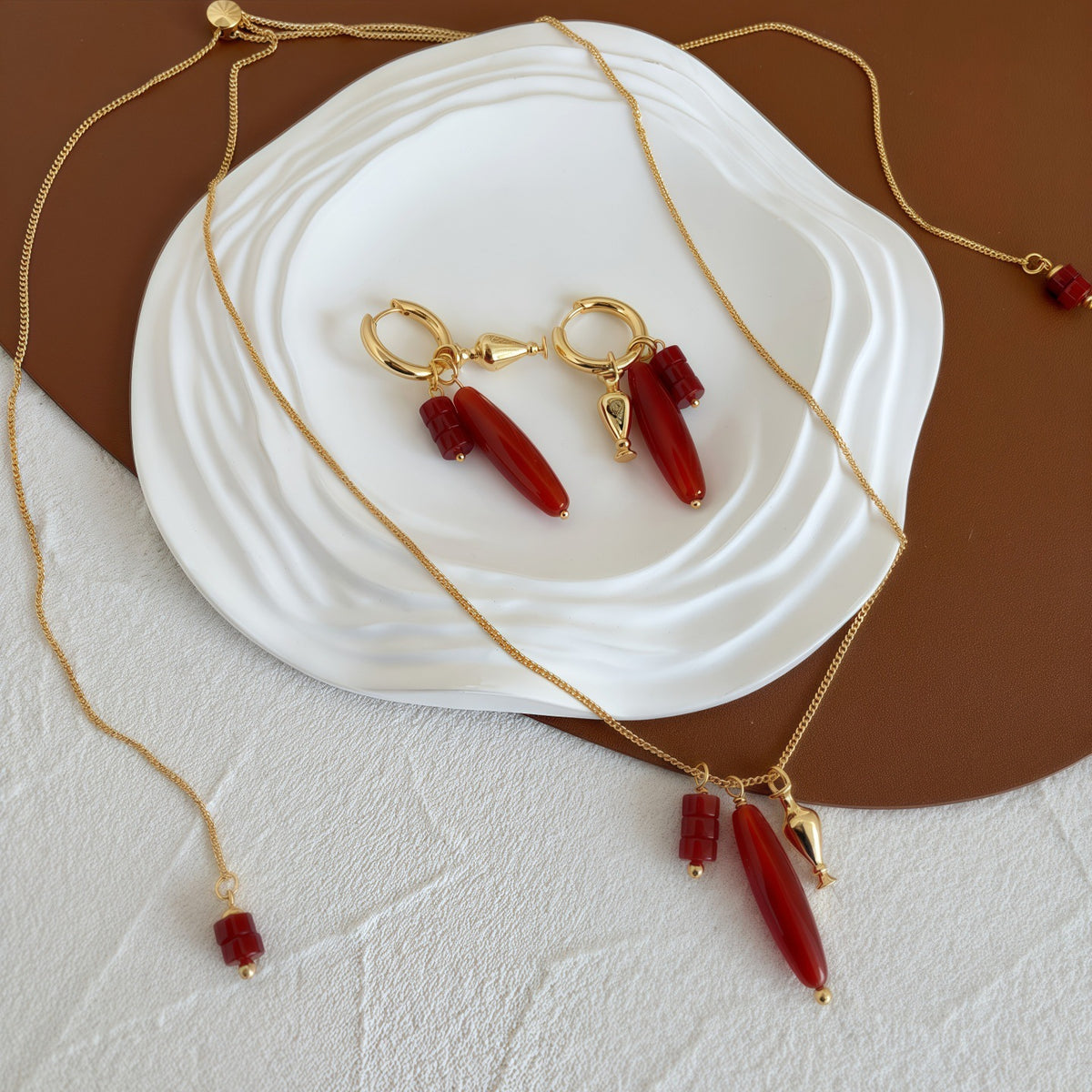 Vessel Red Agate long necklace and sculptural earrings styled together