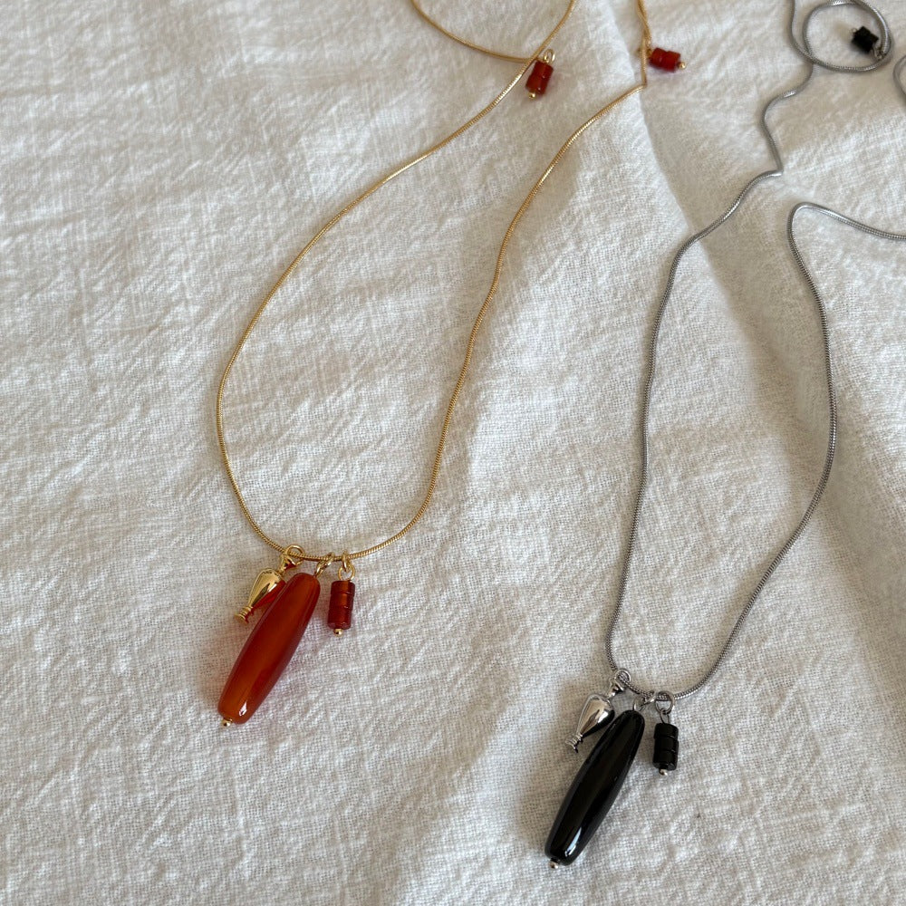 Vessel Red Agate long necklace and Vessel Black Onyx long necklace styled together